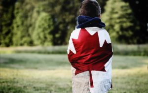 child with Canadian flag